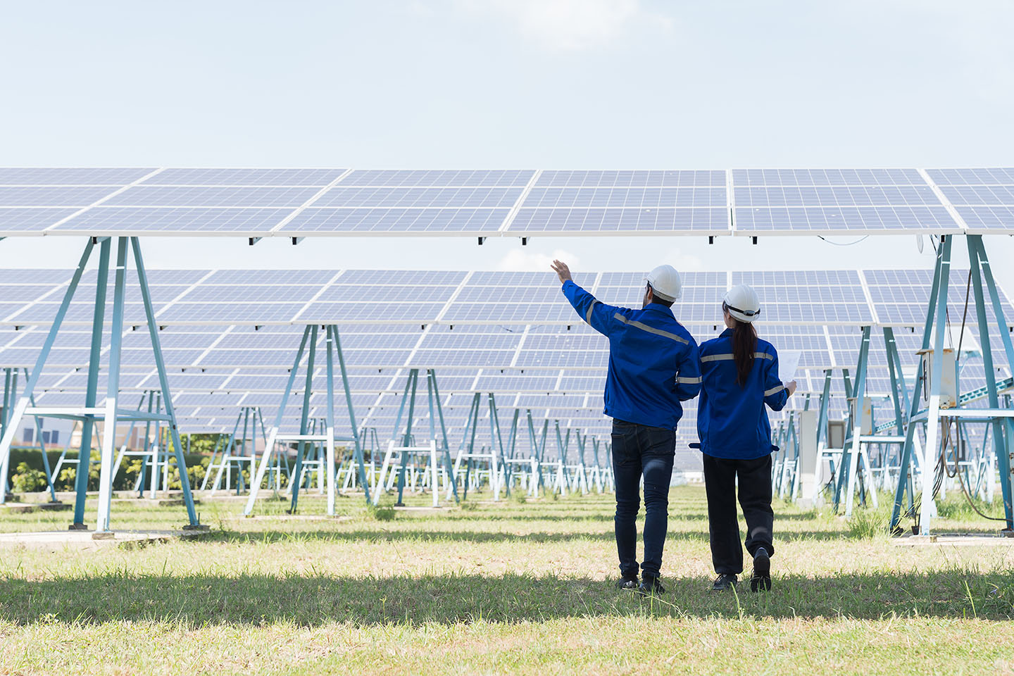 Apprentices Solar Two workers inspecting solar panels